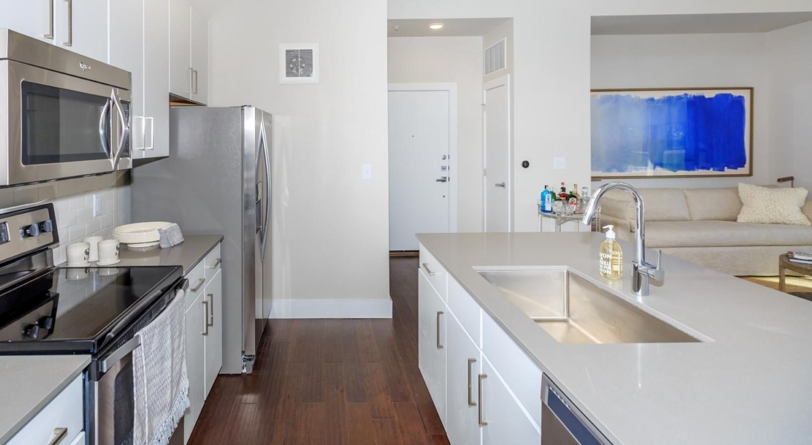 Spacious kitchens with thoughtful details a kitchen with white cabinets