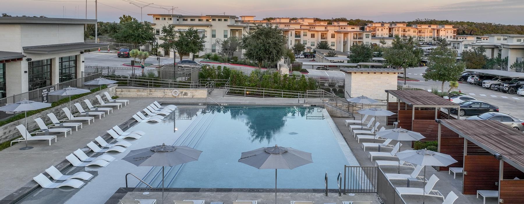 a pool surrounded by buildings