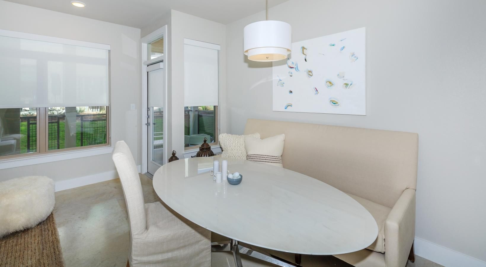 Gorgeous living areas to entertain and enjoy a dining room with a white table and white chairs