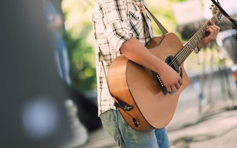 a person playing a guitar