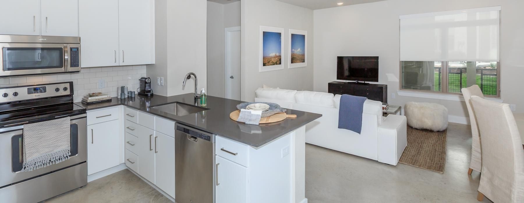 a kitchen with white cabinets