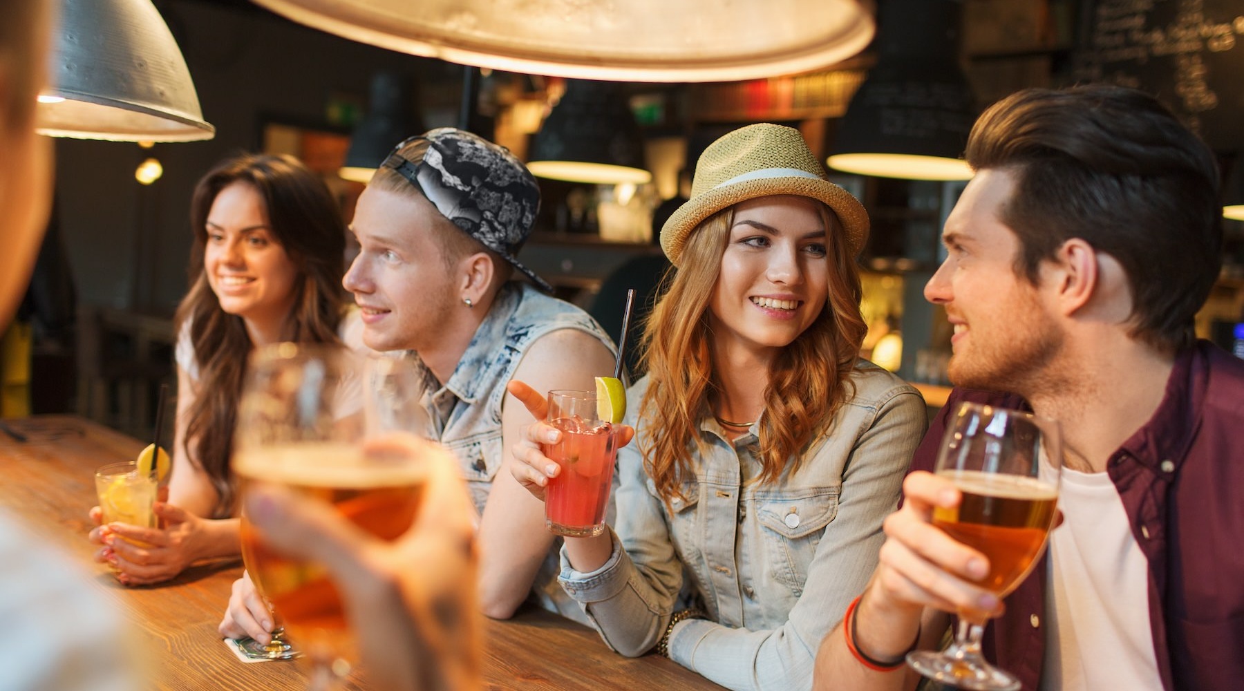 a group of friends hanging out at a bar