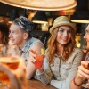 a group of friends hanging out at a bar