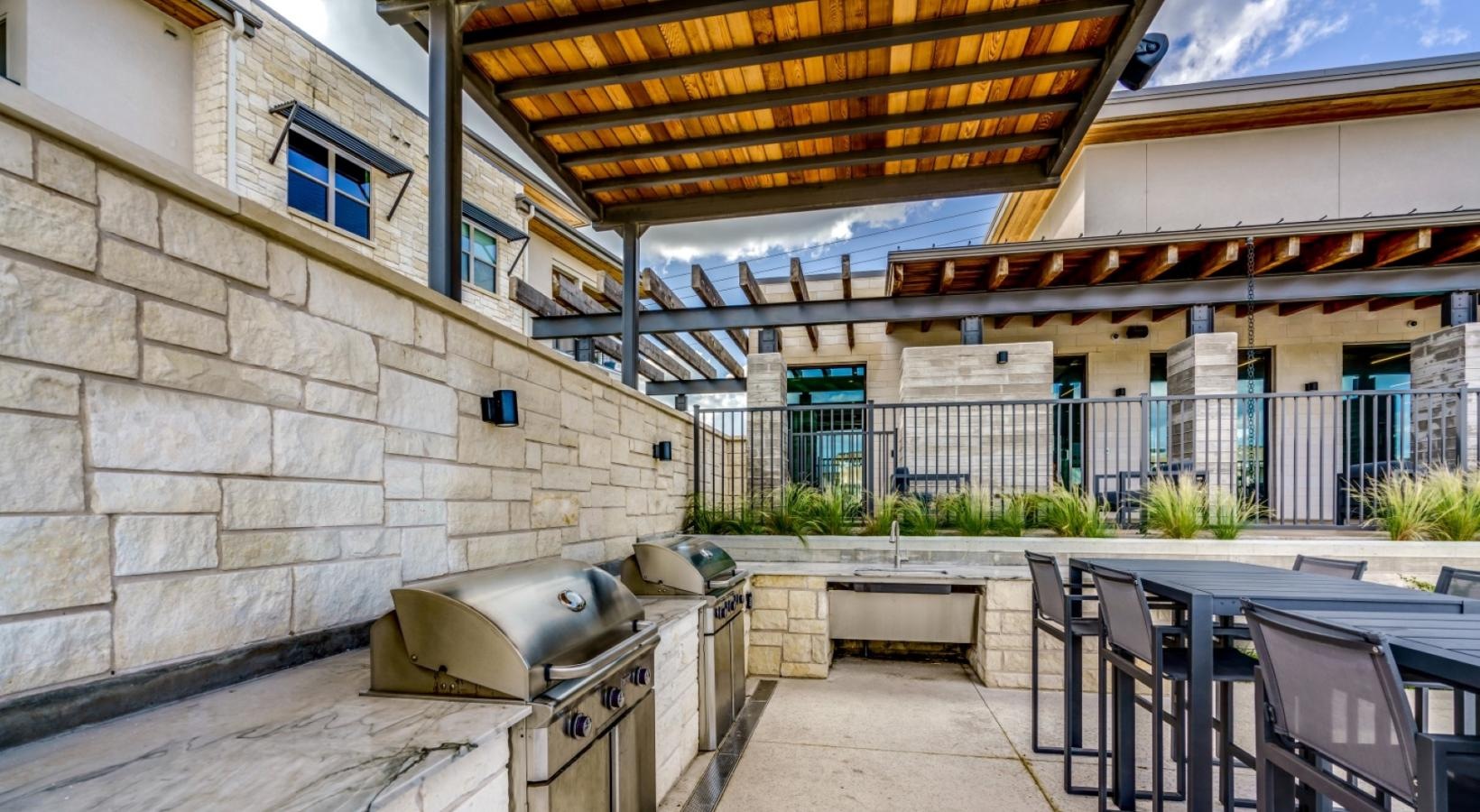 Settle into comfort at Berkshire Santal a patio with tables and chairs