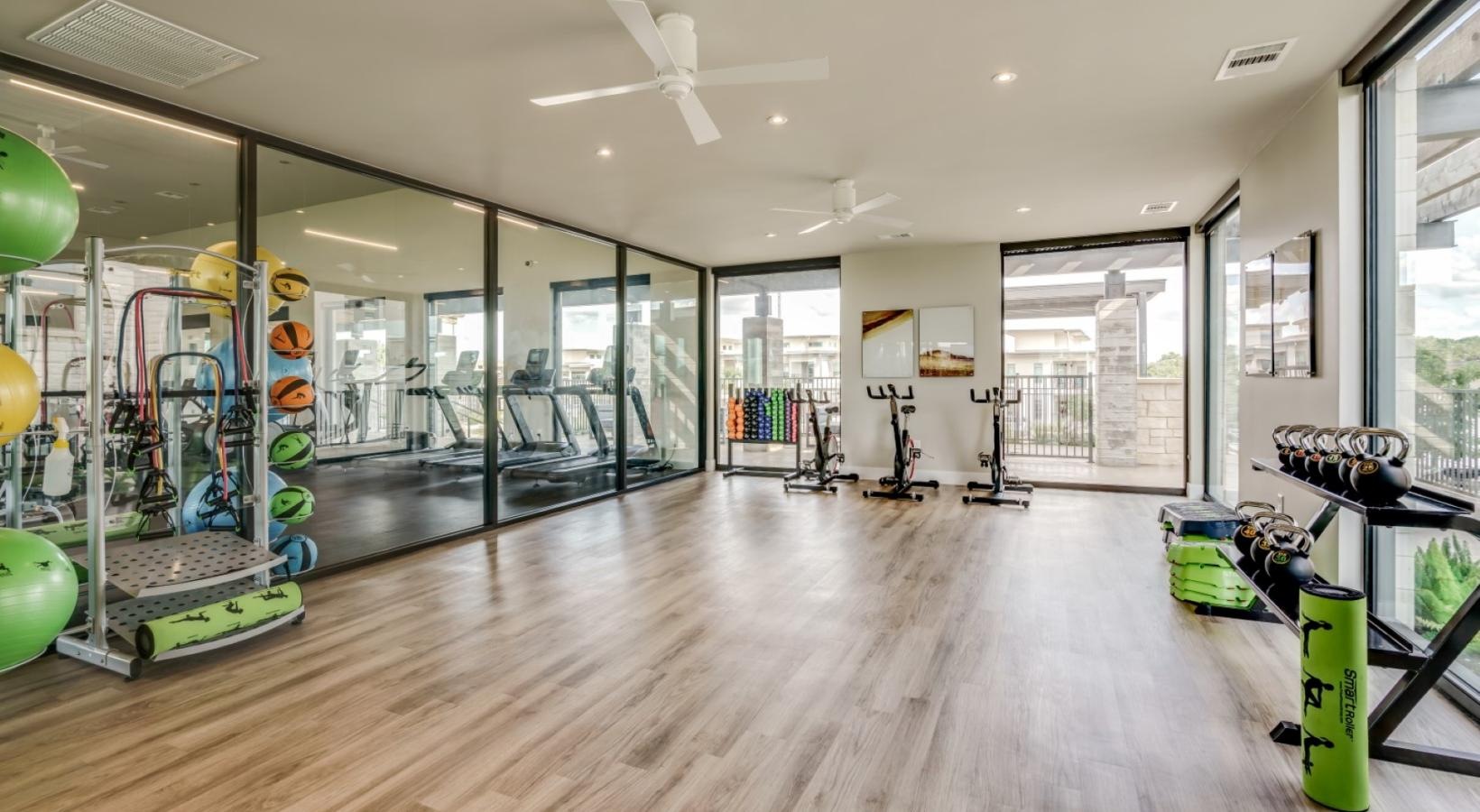 Relax and unwind in stylish living spaces a room with exercise equipment and balloons