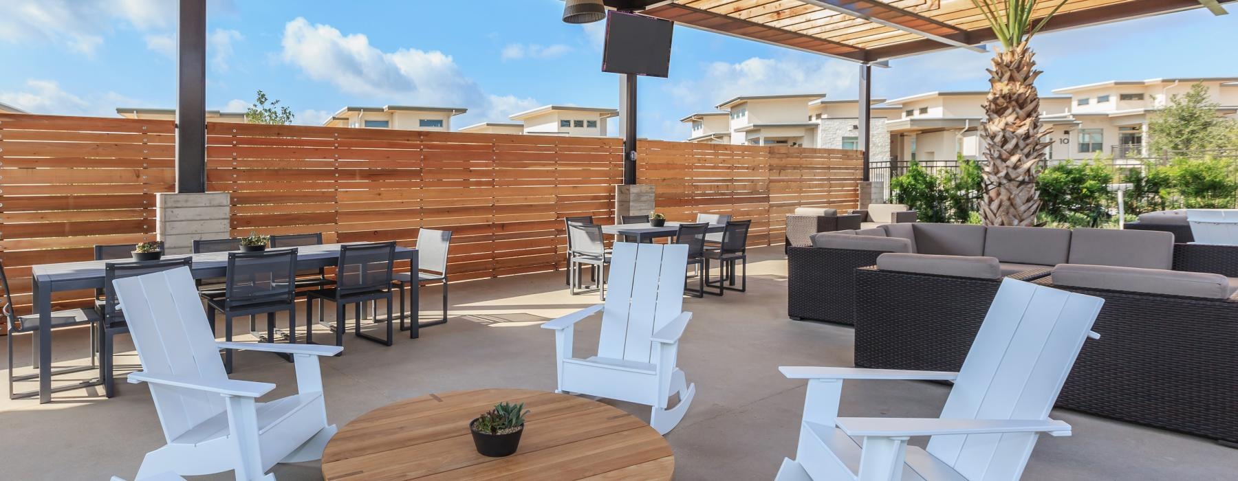 a patio with tables and chairs