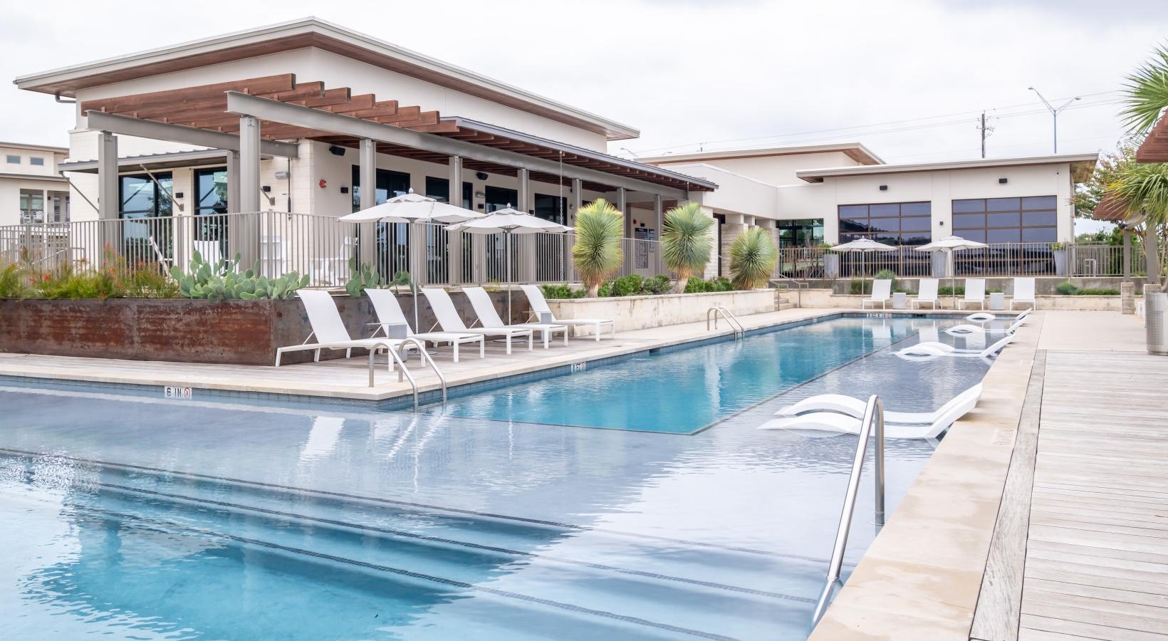 Find your perfect fit at Berkshire Santal a swimming pool with chairs around it