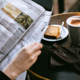 Bustling community with plenty of dining choices a person reading a paper